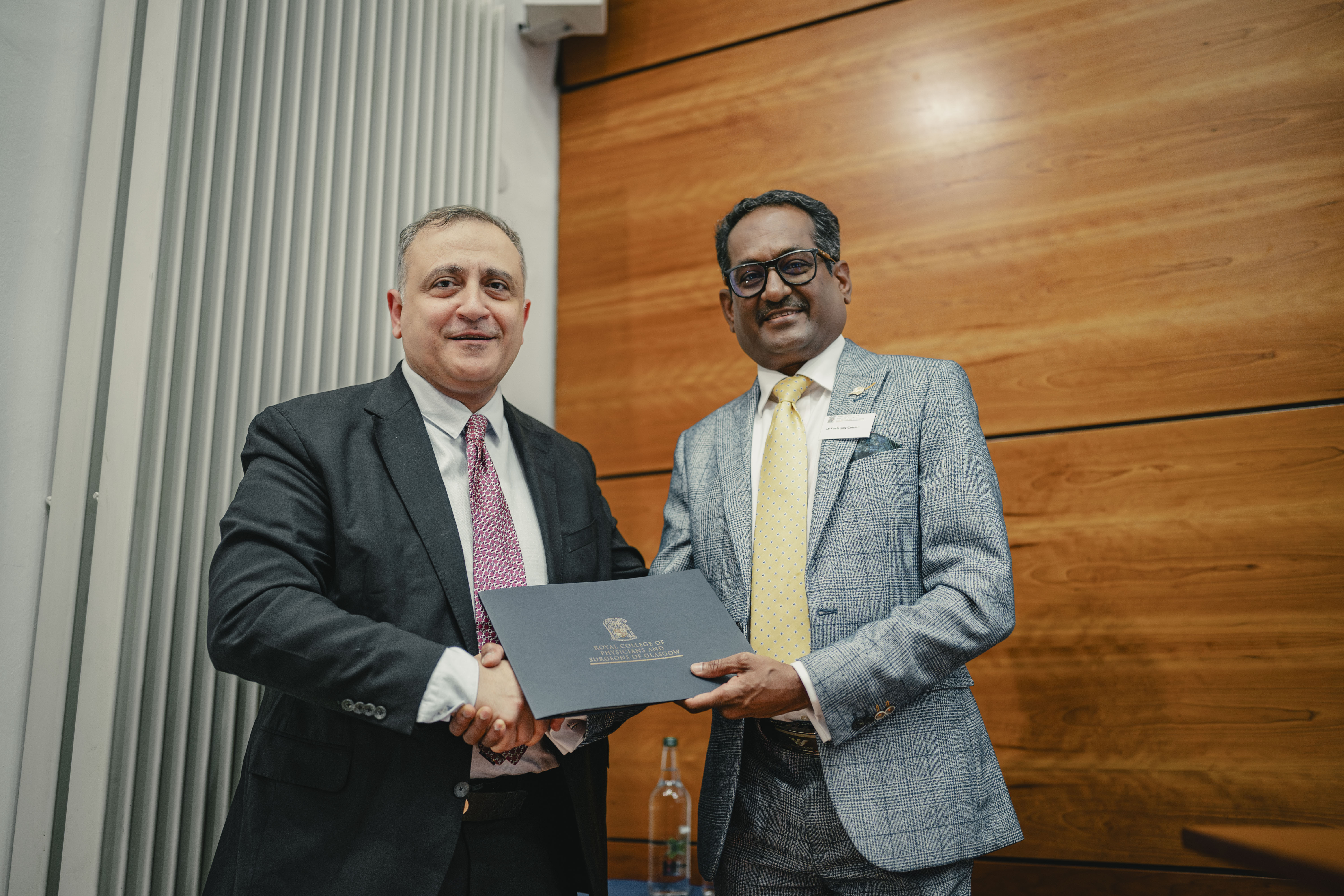 poster participant receiving a certificate